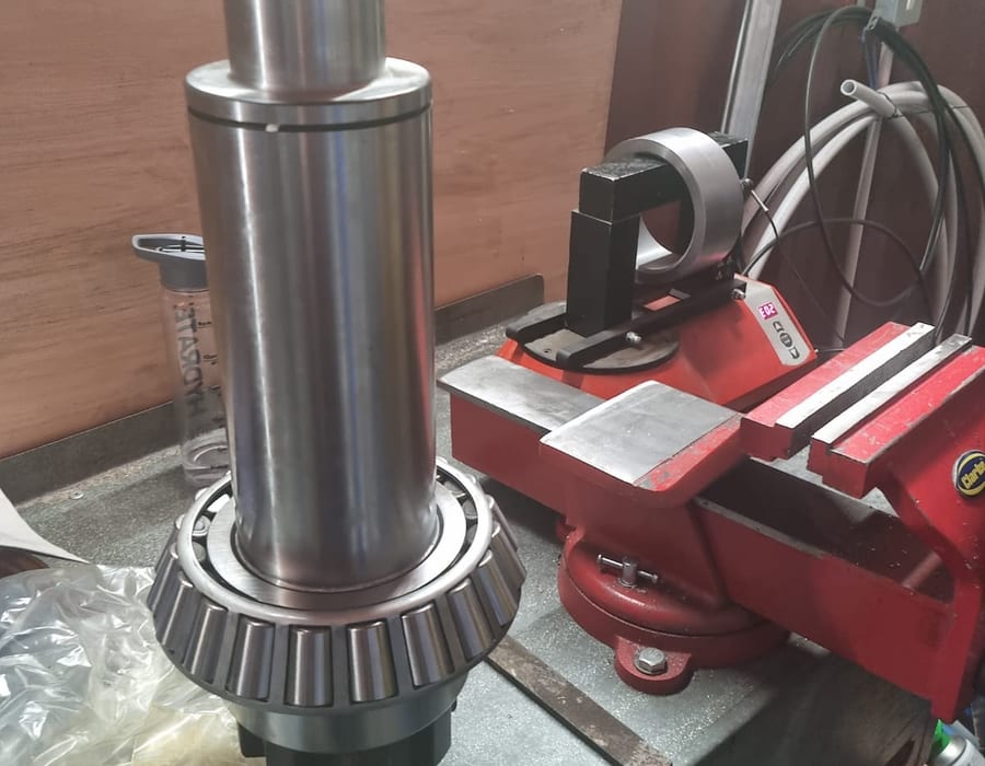 Engineer inspecting machinery in an industrial factory